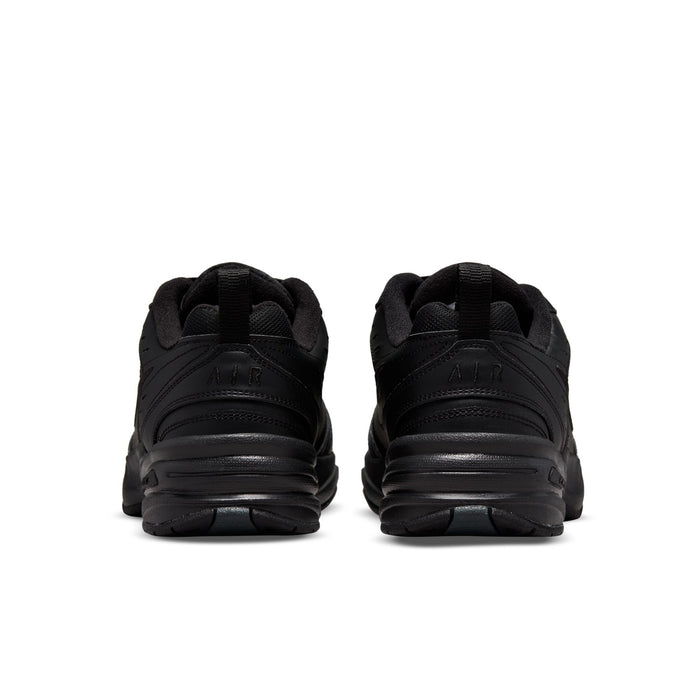 Pair of men's black sneakers, rear heel view with padded collar