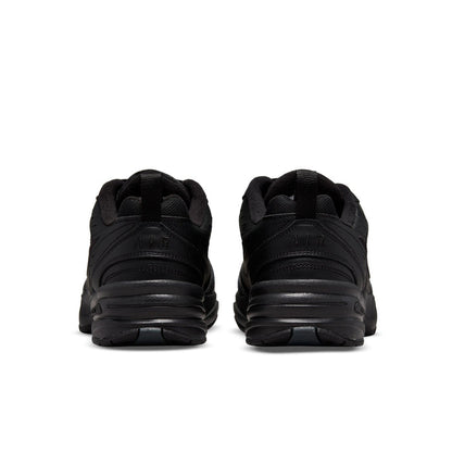 Pair of men's black sneakers, rear heel view with padded collar