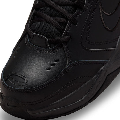 Men's black sneaker toe area with textured leather and stitched panel