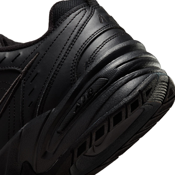Men's black sneaker midsole close-up with ridged cushioning detail