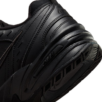 Men's black sneaker midsole close-up with ridged cushioning detail