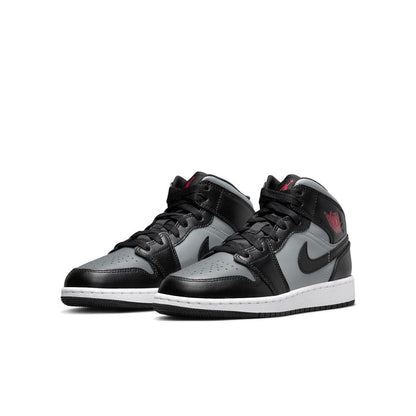 Youth mid-top sneakers, black and gray upper with white midsole and red logo detail