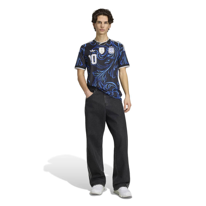 Black jersey with blue swirl pattern and white number 10, short sleeves, crew collar