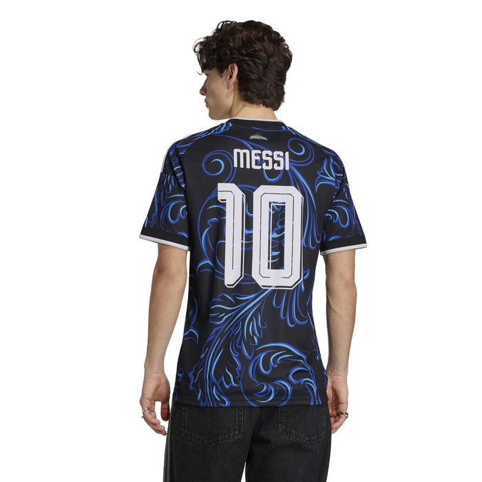Black jersey back view with blue swirls, white MESSI text and number 10