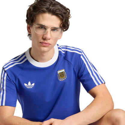 Men's blue soccer T-shirt close-up with adidas logo and Argentina crest on the chest