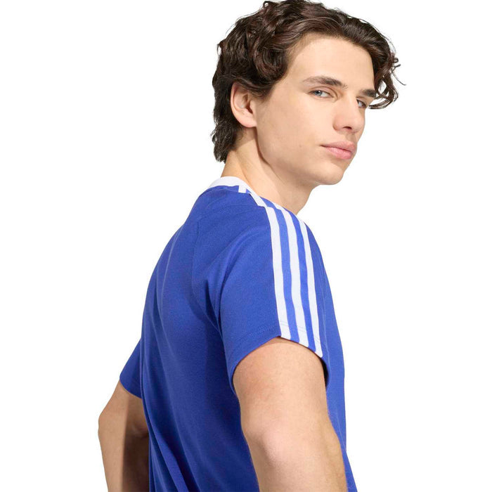 Men's blue soccer T-shirt side view with white sleeve stripes and crew neck trim