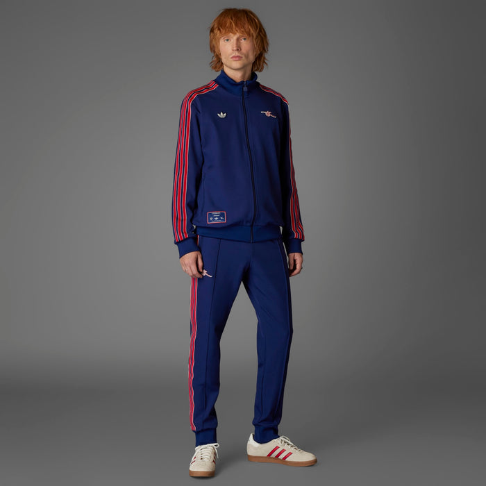 Men’s Arsenal-style blue track pants with red side stripes and zipper pocket