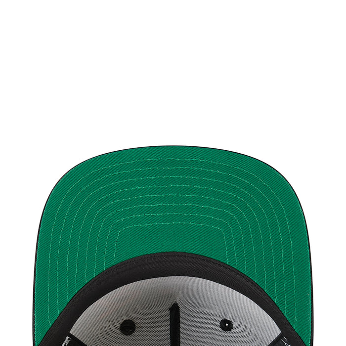 Green underside of baseball cap with black brim and patterned stitching