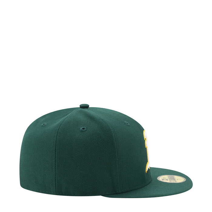 Green baseball cap with side logo detail and curved brim