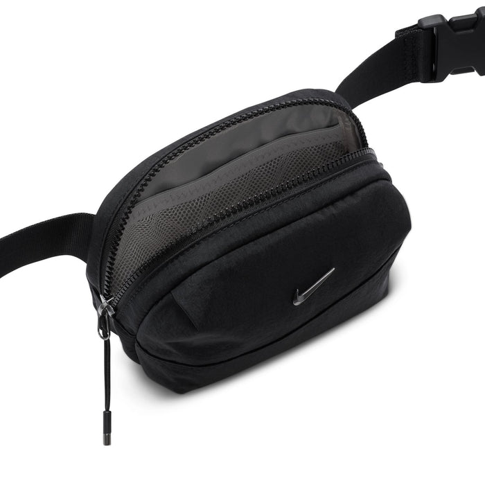 Black crossbody waist bag with front zipper pocket and dangling pull tab, adjustable strap