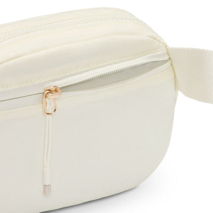 Cream oval crossbody bag close-up of side zipper, ring pull, and trim
