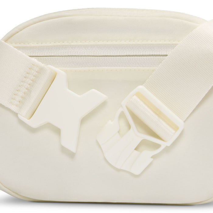 Oval crossbody bag close-up of adjustable strap hardware and interior zipper