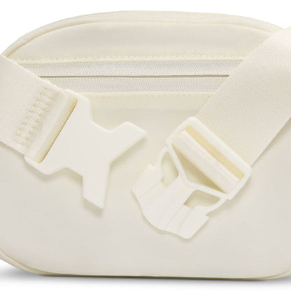 Oval crossbody bag close-up of adjustable strap hardware and interior zipper
