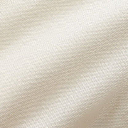Cream woven fabric close-up with fine textured surface