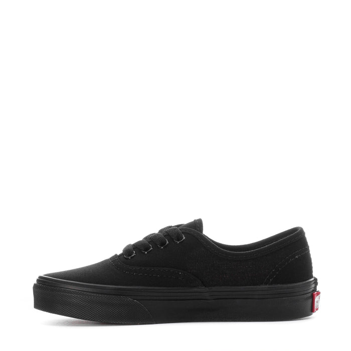 Kids black Vans lace-up sneaker, side view with low-profile rubber sole