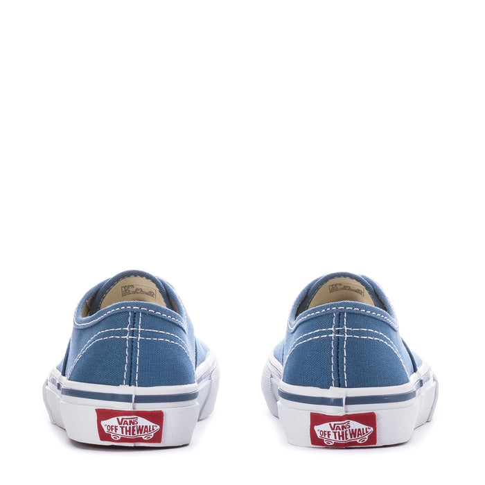 Kids navy canvas Vans sneaker back view with white sole and red “Off the Wall” patch