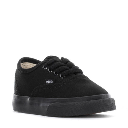 Toddler black low-top sneakers, front view with lace-up eyelets and Vans tag