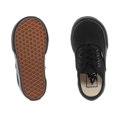 Toddler black low-top sneakers, rubber outsole tread and Vans insole label