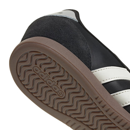 Women’s mary jane sneaker heel detail, black upper with brown textured tread