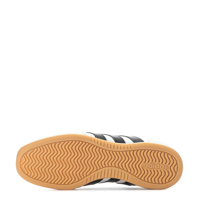 Youth Mary Jane sneaker outsole, tan rubber with wavy tread and adidas mark.