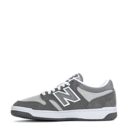 Youth New Balance sneakers, dark gray suede with lighter accents, lace-up front, white sole