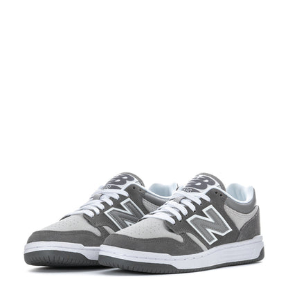 Youth New Balance pair of gray low-top sneakers with white laces and midsole