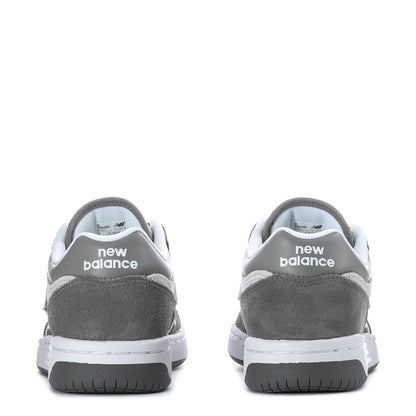 Youth New Balance sneakers with heel branding, dark gray suede, white midsole, black rubber tread