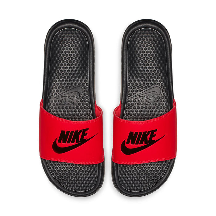 Pair of red slide sandals with black textured footbeds and Nike logos