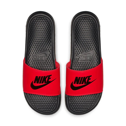 Pair of red slide sandals with black textured footbeds and Nike logos