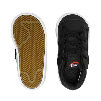 Black toddler sneaker soles view: brown tread outsole and white edge midsole.