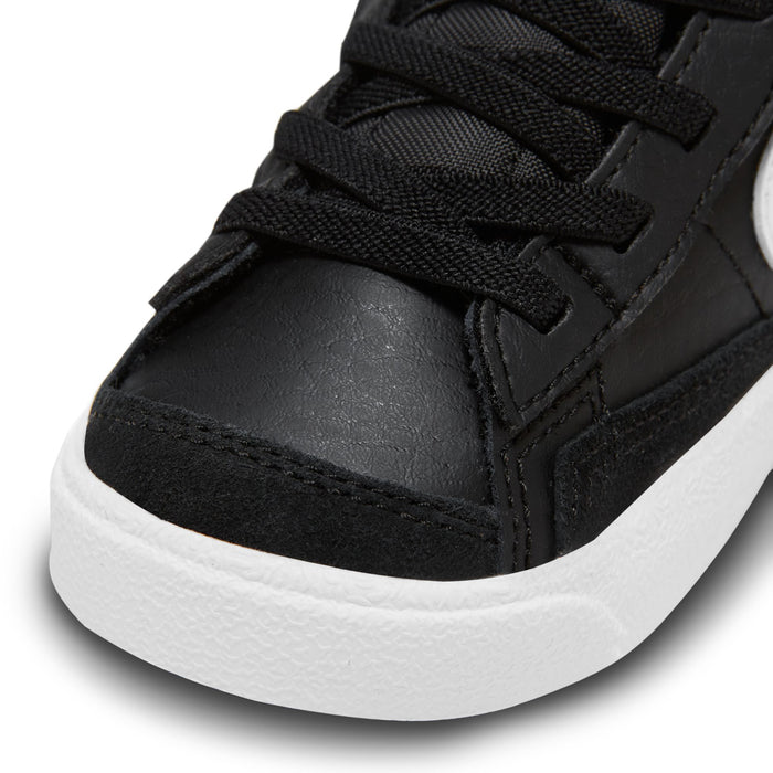 Black toddler high-top sneaker toe and laces with textured panels and white midsole.
