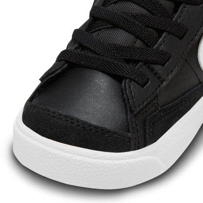 Black toddler high-top sneaker toe and laces with textured panels and white midsole.
