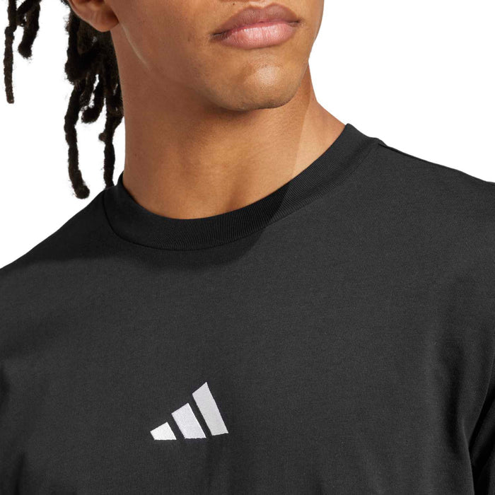 Black crewneck t-shirt with small white adidas logo and ribbed neckline