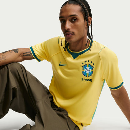 Yellow Brazil home jersey with teal collar trim and CBF crest on chest