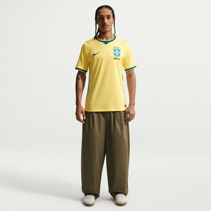 Yellow Brazil home soccer jersey with teal collar and CBF badge at center