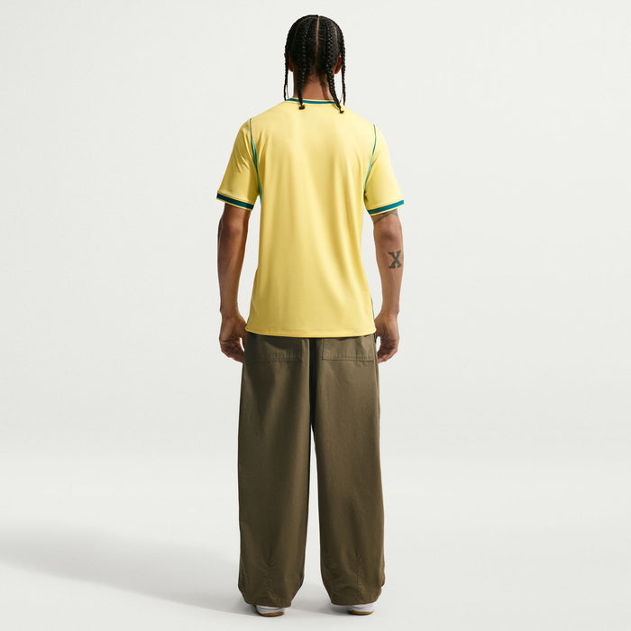 Yellow Brazil home soccer jersey back view with teal collar and sleeve trim