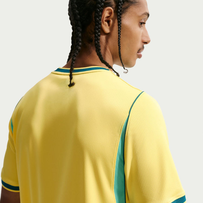 Yellow Brazil jersey with teal side panel trim and ribbed collar detail