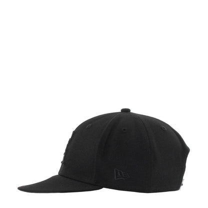 Black baseball cap with small side logo on crown