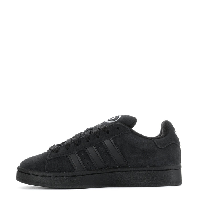 Youth black low-top sneaker, side view with lace-up design and textured sole