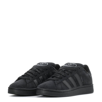 Pair of black youth low-top sneakers, front view with lace-up and stripes