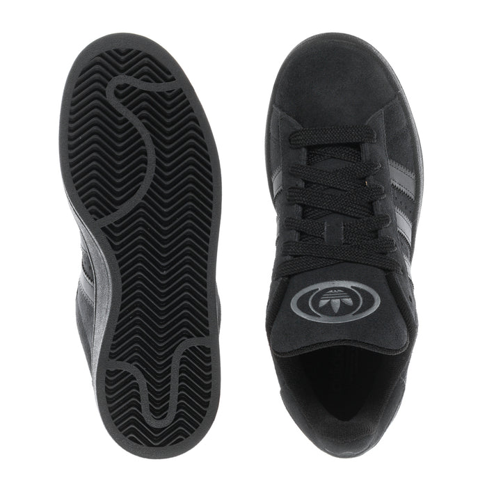Black sneaker soles and toe view showing tread pattern and lace-up upper