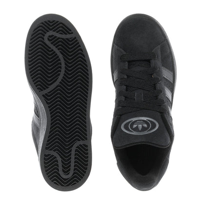Black sneaker soles and toe view showing tread pattern and lace-up upper