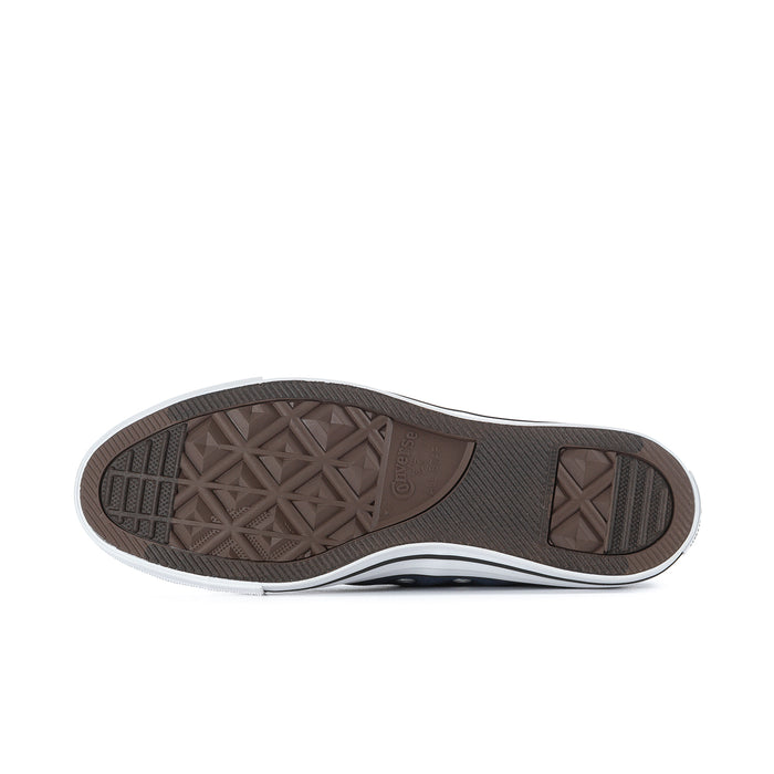 Low-top sneaker outsole with textured rubber tread and white midsole