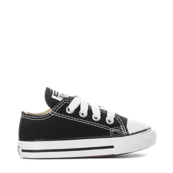 Toddler black Chuck Taylor All Star ox sneakers, side view with white laces and toe cap
