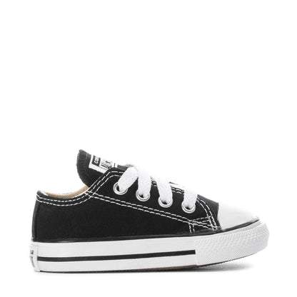 Toddler black Chuck Taylor All Star ox sneakers, side view with white laces and toe cap