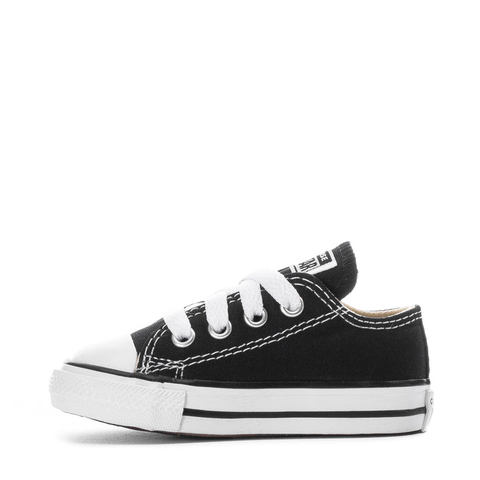 Toddler black canvas Chuck Taylor All Star sneakers, angled side with white lace-up front