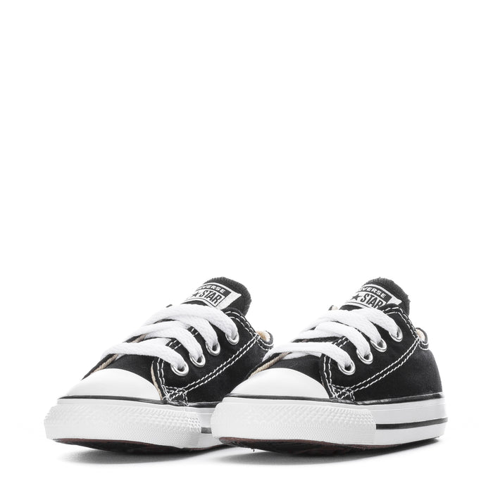 Toddler pair of black and white Chuck Taylor All Star ox sneakers with classic stitching