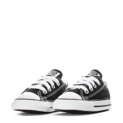 Toddler pair of black and white Chuck Taylor All Star ox sneakers with classic stitching