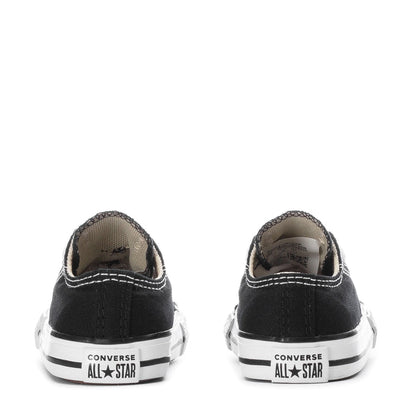 Toddler black canvas Chuck Taylor All Star sneakers, rear view with white rubber sole
