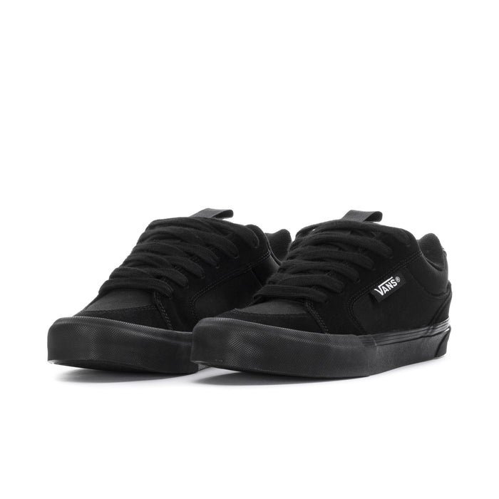 Black lace-up chukka-style sneakers, low profile, Vans logo on side